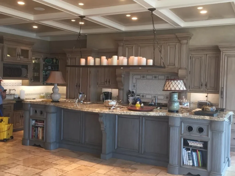 Custom kitchen backsplash integrated with classic cabinetry and stone countertops